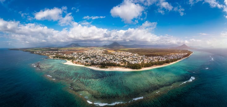 Beautiful Mauritius Island with gorgeous beach Flic en Flac, aerial view from drone. Mauritius, Black River, Flic-en-Flac view of oceanside village beach and luxurious hotel in summer.