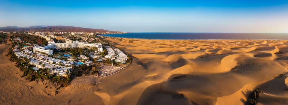 Landscape with Maspalomas town and golden sand dunes, Gran Canaria, Canary Islands, Spain. Natural Reserve of Dunes of Maspalomas, in Gran Canaria, Canary Islands, Spain.