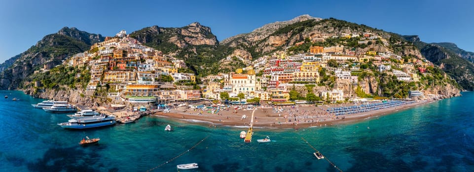 Aerial view of Positano with comfortable beach and blue sea on Amalfi Coast in Campania, Italy. Positano village on the Amalfi Coast, Salerno, Campania. Beautiful Positano, Amalfi Coast in Campania.