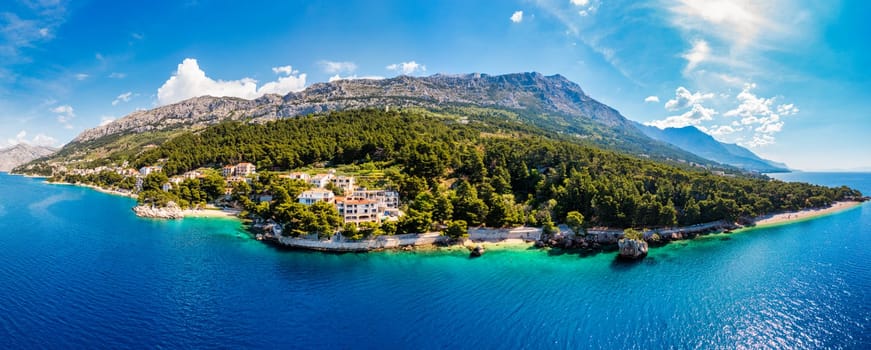 Beautiful Brela on Makarska riviera, Croatia. Adriatic Sea with amazing turquoise clean water and white sand. Aerial view of Brela beach and waterfront on Makarska riviera, Dalmatia region of Croatia.