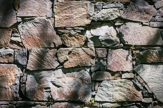 Full frame of a facade of a wall of stone constructed with volcanic rocks of origin 1