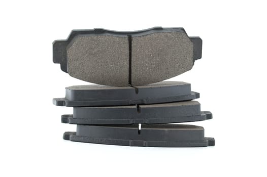 New disc brake pads isolated on white background, brake parts, replacement parts for vehicle