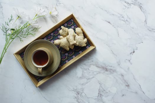 Ginger tea on wooden background