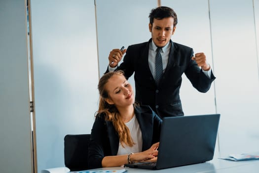 Businessman boss feels angry and mad at bad misbehaving businesswoman employee who ignores the work tasks at the workplace. Firing workers and human resources management problem concept. uds