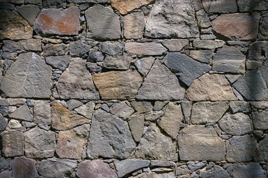 Stone wall texture background - grey stone with different sized stones 4