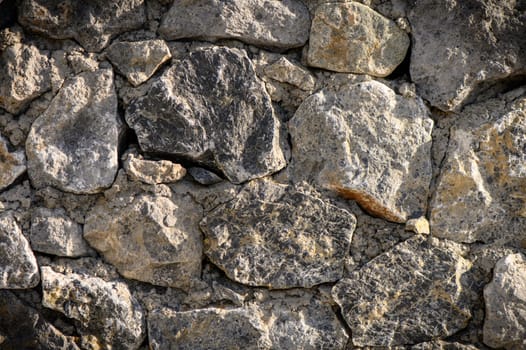 grey stone dark wall of medieval horizontal stones facade background 3