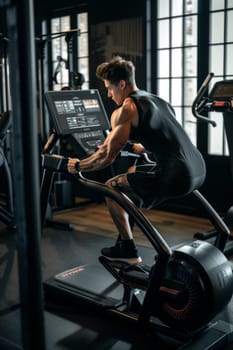 Toned athlete in focused workout session on a modern stationary bike, showcasing strength and endurance in a high-tech gym environment