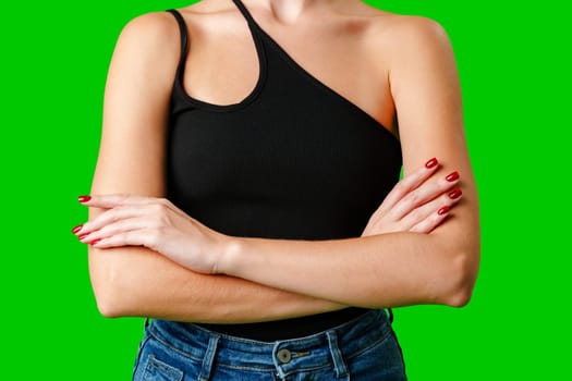 Woman in Black Tank Top Holding Hands Together against green background