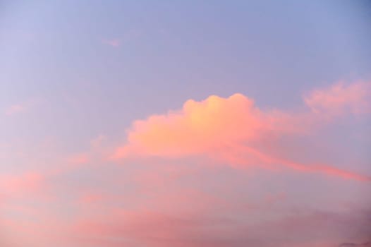 Light pink clouds in sunset blue sky. 1