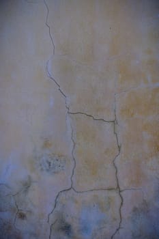 cracked concrete wall covered with gray cement surface as background