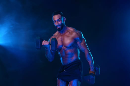 Bodybuilder in neon colors. Athlete man posing on black background. Sports concept. Bodybuilding competition. Social media template for reels, shorts, stories