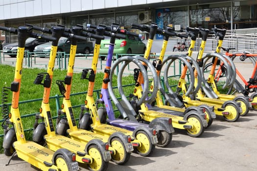 Moscow, Russia - Apr 26. 2024. Short-term rental service for electric scooters Yandex Go