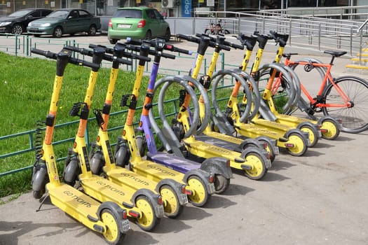 Moscow, Russia - Apr 26. 2024. Short-term rental service for electric scooters Yandex Go