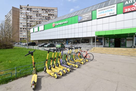 Moscow, Russia - Apr 26. 2024. Short-term rental service for electric scooters Yandex Go