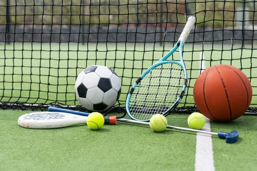 Set of sport equipment on green grass. High quality photo