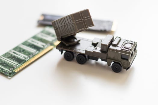 A toy military vehicle with a rocket and microcircuit. High quality photo