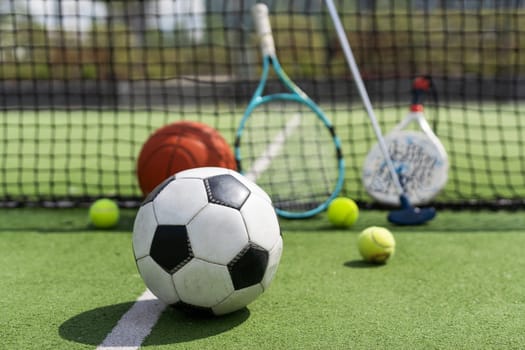Sport games background - basketball, soccer ball, rackets, sneakers - copy space. High quality photo