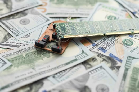 Semiconductor chips shortage and high price. Pile of computer chips and spreadof US dollars. Concept for crisis in the industry in the United States. . High quality photo