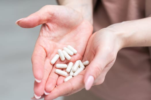 Medicine in hand on a white background. High quality photo