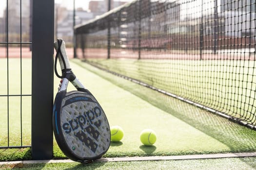 Ukraine Kyiv, April 02 2024. Paddle tennis racket and ball. High quality photo