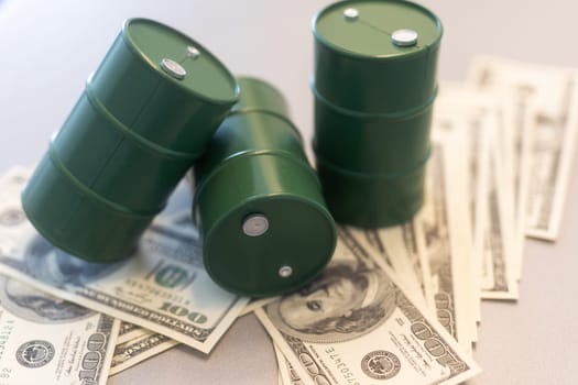 Barrel of crude oil with dollar bills. Close up. Business concept. High quality photo