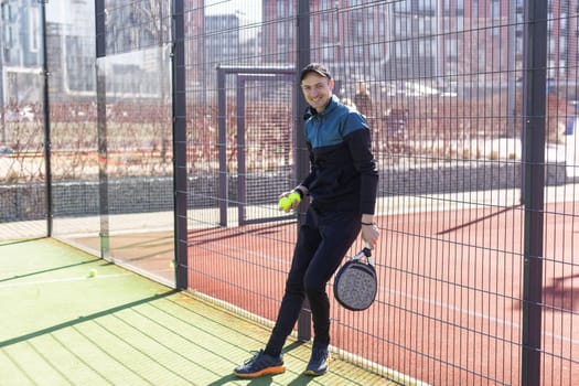 Paddle tennis player serving training with her couple in court. High quality photo