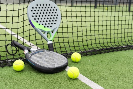 Paddle tennis objects on grass court. High quality photo