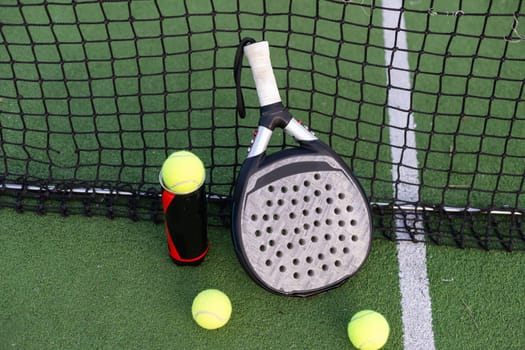 Paddle tennis objects on grass court. High quality photo