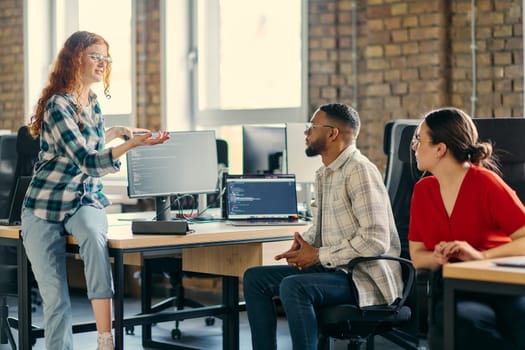 A diverse group of young business individuals congregates in a modern startup coworking center, embodying collaborative innovation and a dynamic atmosphere.