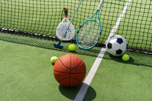 Set of sport equipment on green grass. High quality photo