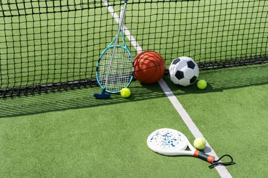 Set of sport equipment on green grass. High quality photo