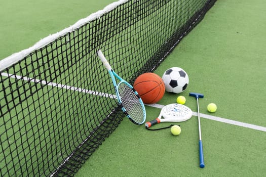 Set of sport equipment on green grass. High quality photo