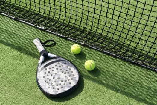 paddle tennis racket, ball. close- up on the racket. High quality photo