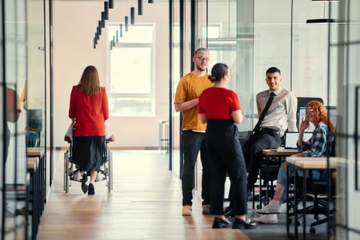 A dynamic group of young entrepreneurs engages in vibrant discussion within a modern glass office space, exploring new business projects and fostering innovation.