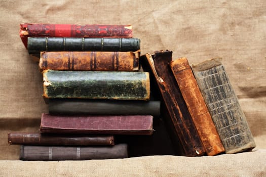 Set of various old books on canvas background