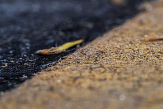 Close-up Asphalt floor and yellow dividing line