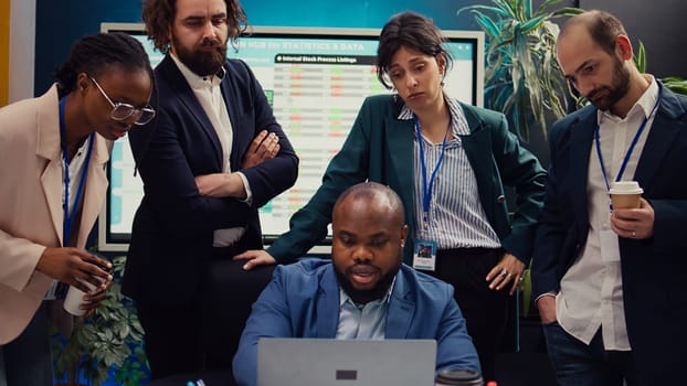 Sales team reviewing market trends and statistics in a boardroom, meeting to create a report for the new marketing strategy. Employees participants brainstorm innovative ideas. Camera B.