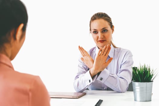 Two young business women in meeting at office table for job application and business agreement. Recruitment and human resources concept. uds