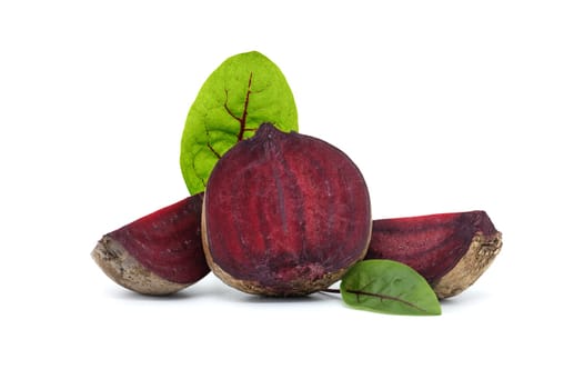 Collection slices of beetroot, complete with their green leaves isolated on white background