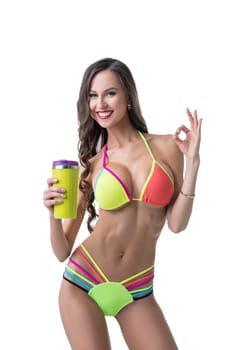 Sports nutrition. Image of sexy model shows gesture OK