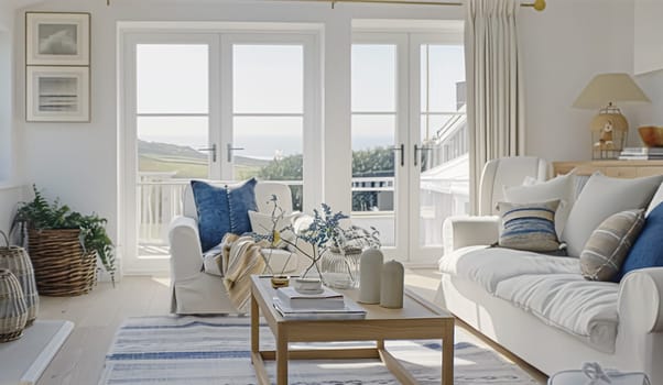 Interior of a living room with white walls, sofa and cushions. Sitting room in coastal cottage with sea view. Luxury lounge room