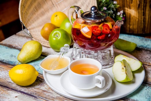 fruit tea in a glass teapot at a tea ceremony.