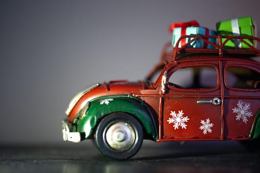 toy iron car model with gifts on the roof. interior detail