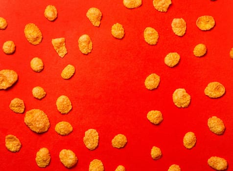 corn flakes on a red background top view.