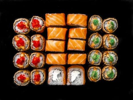 rolls set on a black background. three kinds roll for the menu.