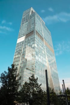 glass skyscraper in the city on a summer day.