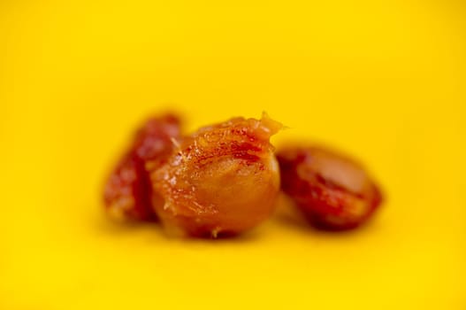 cherry pits, fruit pits on a yellow background.