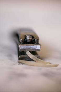 close-up nail clippers with human fingernail.