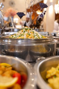 a pot of rice and vegetables in a cafe