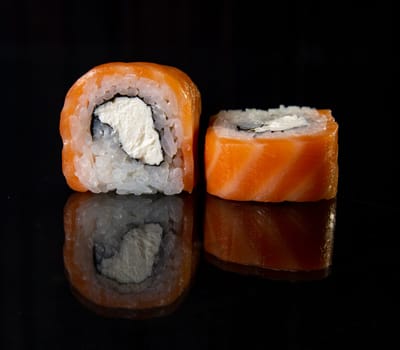 classic japanese rolls with cheese and red fish.